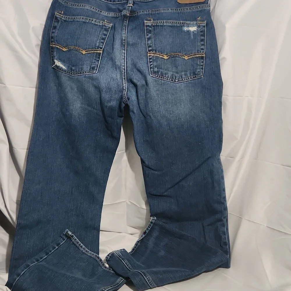 American Eagle Outfitters Men's Button Fly Low Rise Bootcut Distressed Jeans